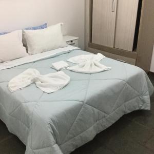 Säng eller sängar i ett rum på Pousada da Mércia - Itapuã (BA)