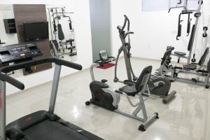 a gym with several exercise bikes in a room at Benos Hotel in Santa Rosa