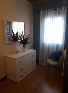 a room with a dresser with a mirror and a window at Mar de Prata in Maia