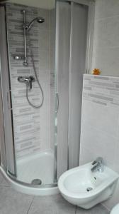 a bathroom with a shower and a sink at Boschetto in Riva del Garda