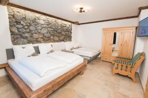 Postel nebo postele na pokoji v ubytování Gletscher Appartements