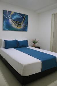 Ένα ή περισσότερα κρεβάτια σε δωμάτιο στο Hotel Pereira 421