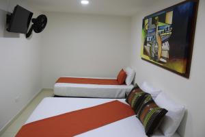 Ένα ή περισσότερα κρεβάτια σε δωμάτιο στο Hotel Pereira 421