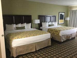 two beds in a hotel room with two at Baymont by Wyndham Page Lake Powell in Page