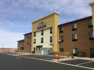 a large building with a sign on the side of it at Baymont by Wyndham Page Lake Powell in Page