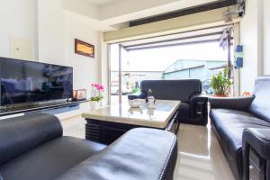 TV a/nebo společenská místnost v ubytování Yilan Dongshan Cypress B&B