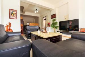TV a/nebo společenská místnost v ubytování Yilan Dongshan Cypress B&B