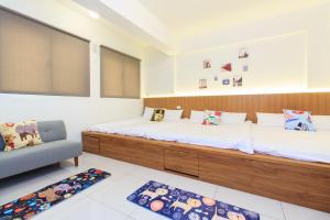 Postel nebo postele na pokoji v ubytování Yilan Dongshan Cypress B&B