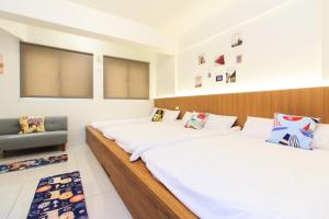 Postel nebo postele na pokoji v ubytování Yilan Dongshan Cypress B&B