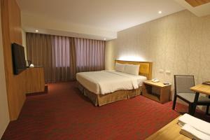 Postelja oz. postelje v sobi nastanitve Bamboo Hotel
