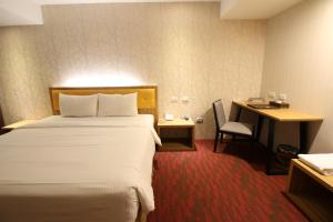 Postelja oz. postelje v sobi nastanitve Bamboo Hotel