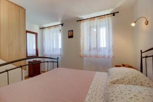 Postel nebo postele na pokoji v ubytování House Medea