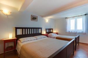 Postel nebo postele na pokoji v ubytování House Medea