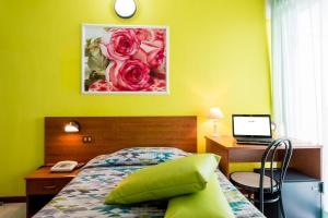 Postel nebo postele na pokoji v ubytování Hotel Villa Truentum