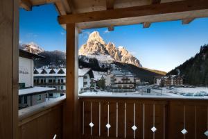 a view from a balcony with a mountain view at Appartamenti Villa Olympia in Corvara in Badia