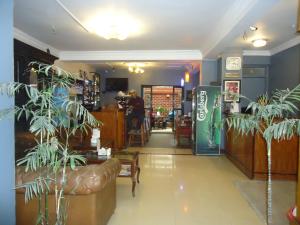 a restaurant with plants in the middle of a room at Hotel Earth House in Kathmandu