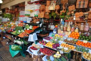 a market filled with lots of fruits and vegetables at Central Suite in Funchal 2N in Funchal