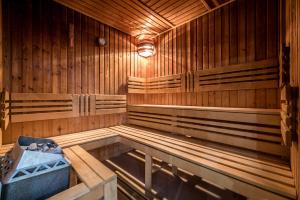 an empty wooden sauna with a light in it at Penzion Fontana in Bešeňová