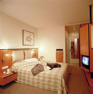 Кровать или кровати в номере Hotel am Rathaus