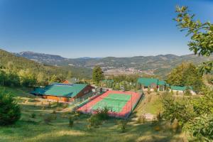 an aerial view of a tennis court in a field at Hotel & Resort Gacka in Mojkovac