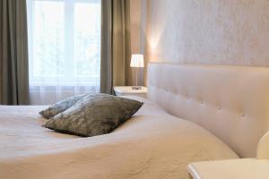Postel nebo postele na pokoji v ubytování Allika Apartments