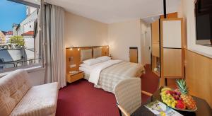 Postel nebo postele na pokoji v ubytování Hotel am Rathaus