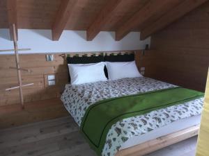 Ein Bett oder Betten in einem Zimmer der Unterkunft Albergo Riglarhaus