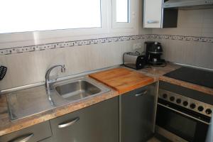 Kuchyňa alebo kuchynka v ubytovaní Apartamento La Torre