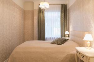 Postel nebo postele na pokoji v ubytování Allika Apartments