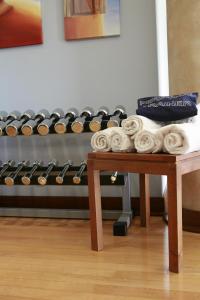 a table with a pile of towels on top of it at Pestana Sintra Golf Resort & SPA Hotel in Sintra