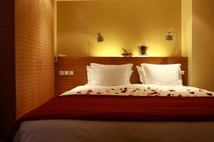 a bedroom with a bed with flowers on it at Pestana Sintra Golf Resort & SPA Hotel in Sintra