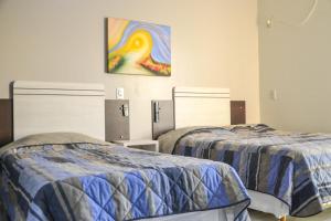 Katil atau katil-katil dalam bilik di Hotel Almanara