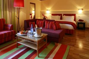 a living room with a couch and a bed at Pestana Sintra Golf Resort & SPA Hotel in Sintra