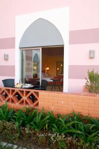 a view of a house from the outside with a patio at Pestana Sintra Golf Resort & SPA Hotel in Sintra