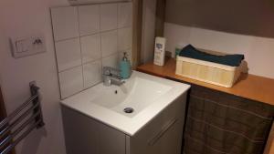 a bathroom with a white sink and a counter at Les Gites du Belvedere - Arbois in Arbois +48 photos
