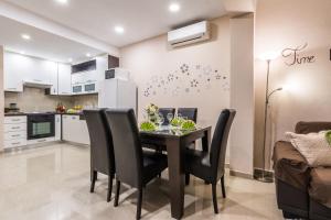 a kitchen and dining room with a table and chairs at Old Town House Pakoštane in Pakoštane +7 photos