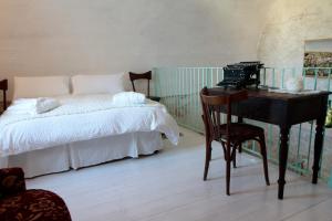 Ένα ή περισσότερα κρεβάτια σε δωμάτιο στο Albergo Diffuso Il Casale