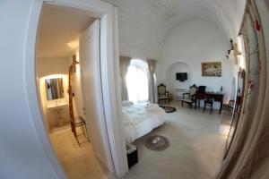 Ένα ή περισσότερα κρεβάτια σε δωμάτιο στο Albergo Diffuso Il Casale