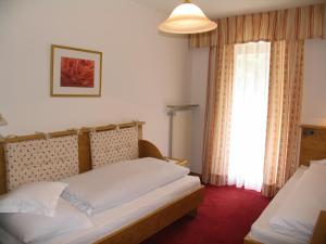 Voodi või voodid majutusasutuse Hotel Reichegger toas