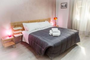 מיטה או מיטות בחדר ב-Foresteria Boccadasse