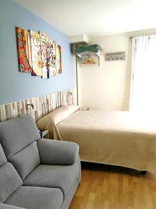 Cama o camas de una habitación en Hotel Apartamentos Aralso