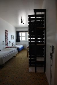 Postel nebo postele na pokoji v ubytování Hotel Angmagssalik