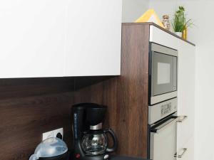 A kitchen or kitchenette at Ferienwohnung - Bergblick - Vandans
