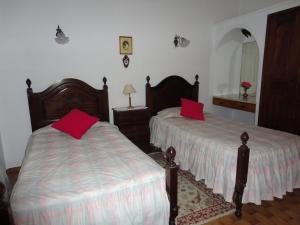 Postel nebo postele na pokoji v ubytování Villa Cristina e Ricardo