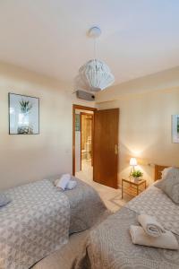 Postel nebo postele na pokoji v ubytování Sitges Holiday Apartment