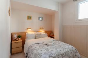 Postel nebo postele na pokoji v ubytování Sitges Holiday Apartment