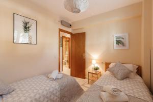 Postel nebo postele na pokoji v ubytování Sitges Holiday Apartment