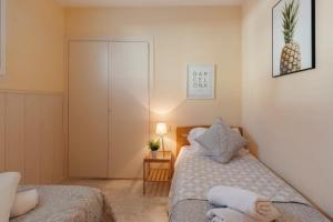 Postel nebo postele na pokoji v ubytování Sitges Holiday Apartment