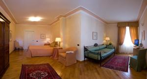 Voodi või voodid majutusasutuse Albergo Castiglione Langhe toas
