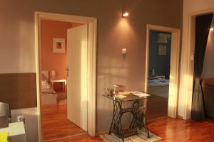 a room with a table and a door leading to a bedroom at Sunny Central Apartment in Sofia